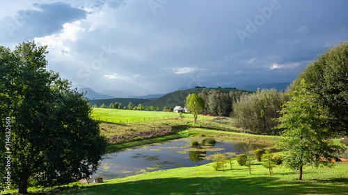 Mountains Farm Cottage Landscape Afternoon Light Summer Rain Clouds © ChrisVanLennepPhoto