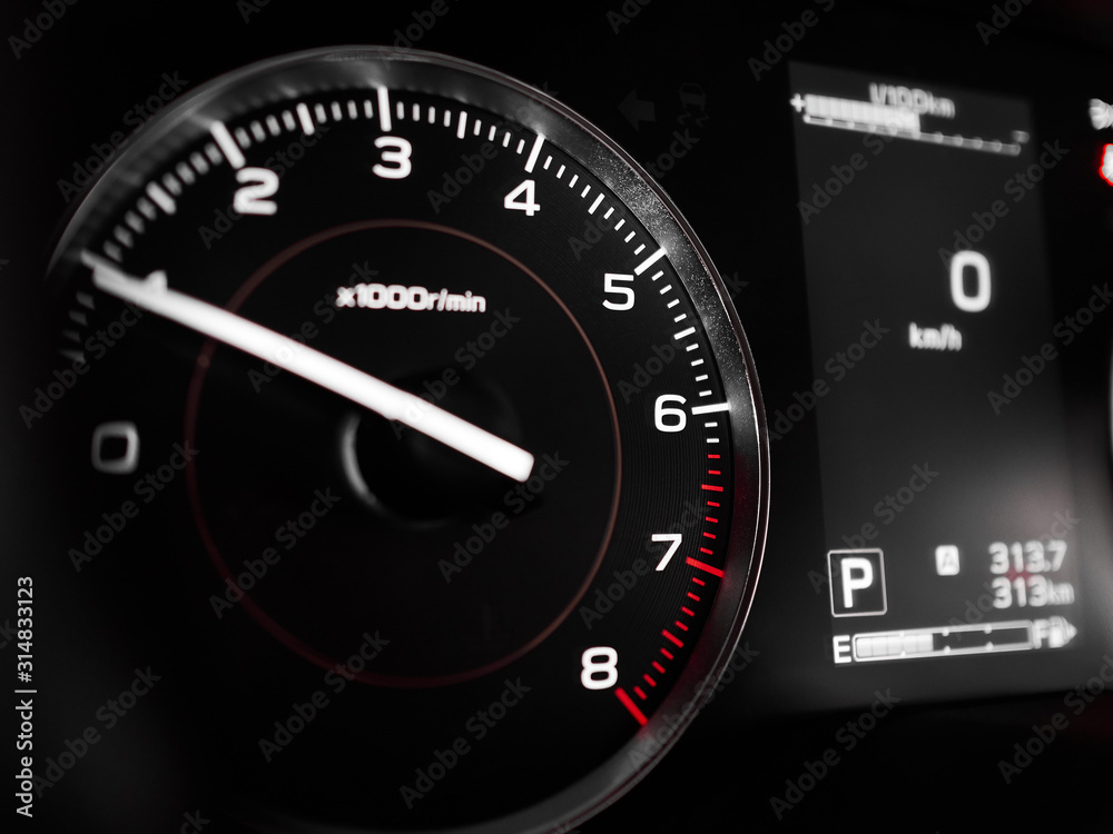 Tachometer RPM and display close-up on dashboard in interior of modern car