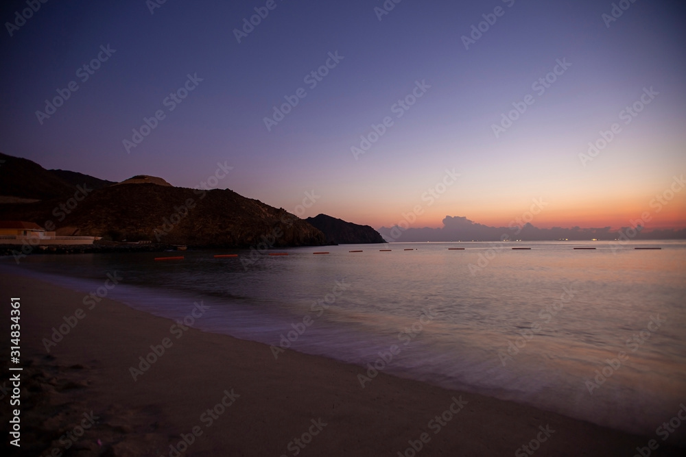 Early morning at hte beach and mountains