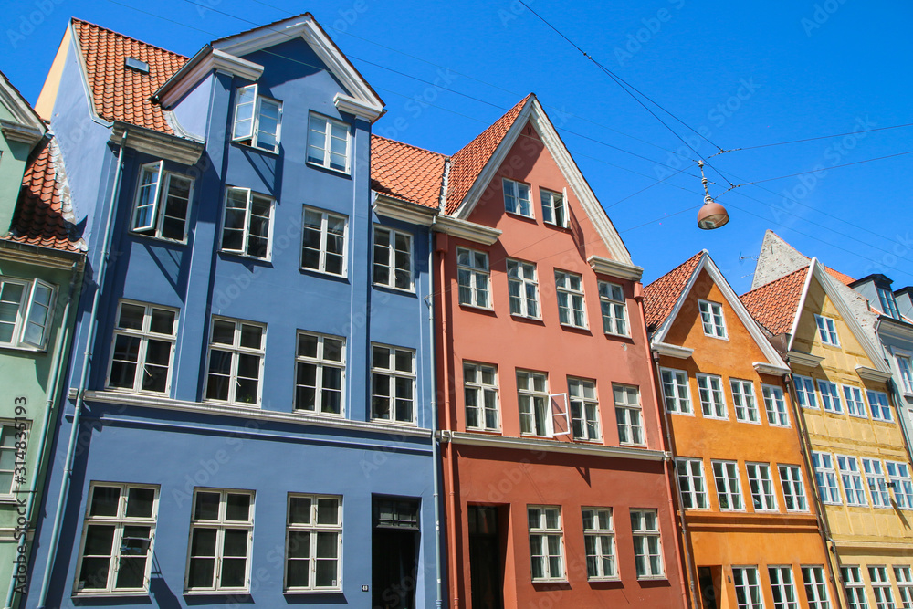 Several old historic houses in Copenhagen in Denmark and their colorful facades.