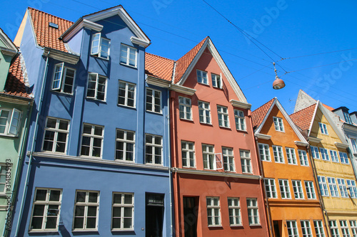 Several old historic houses in Copenhagen in Denmark and their colorful facades.