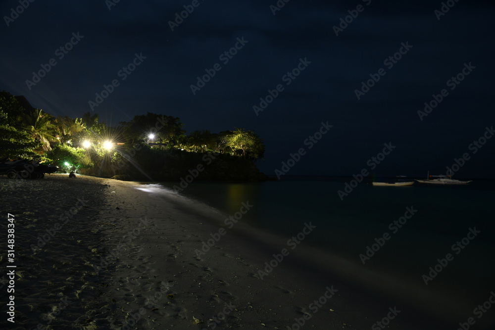 night view of the beach on a tropical island