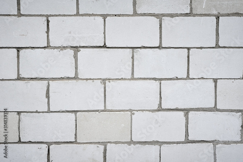 White wall background, closeup. Abstract brick texture