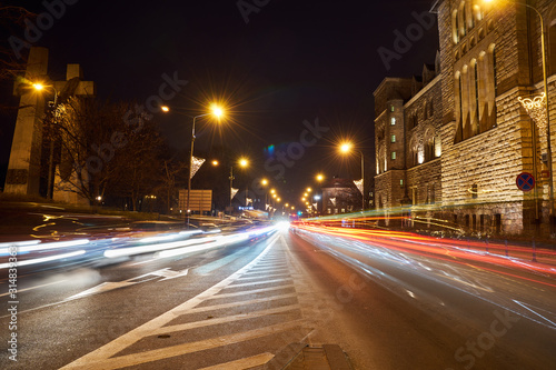 Street and car traffic during the night in Poznan..