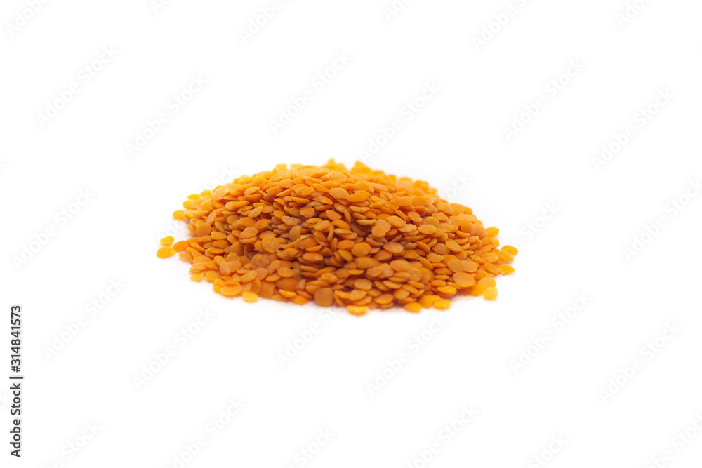 handful of red lentils on a white background handful of red lentils on a white background
