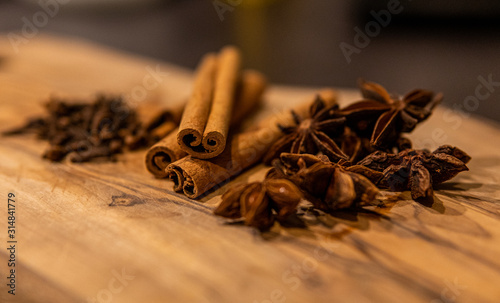 Cinnamon sticks and star anise on wooden background