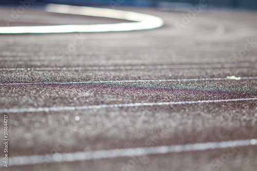 Red running sport track background and texture. Sport running track concept. © Golden House Images