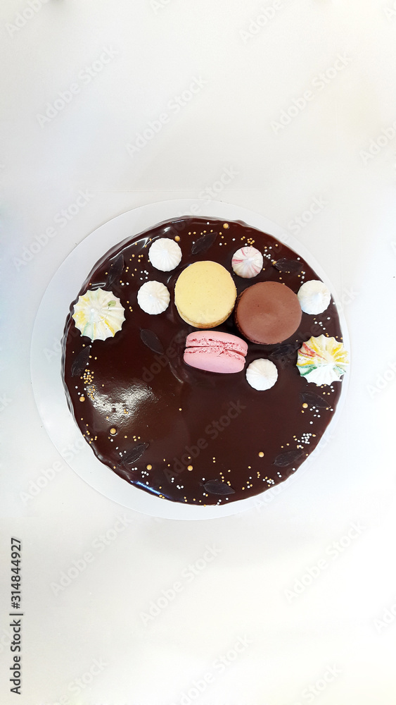 Cake with macarons, marshmallows and candy Cake with macarons, marshmallows and candy