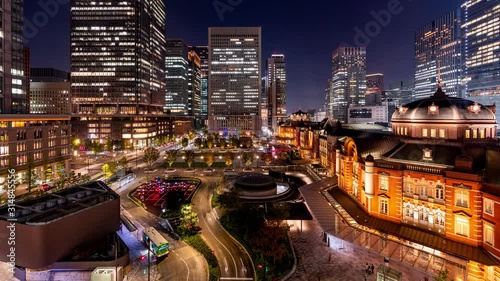 Tokyo, Japan- November 6, 2019: 4K time lapse video of Tokyo Station is the central station in Tokyo People walk around the old building at night. photo