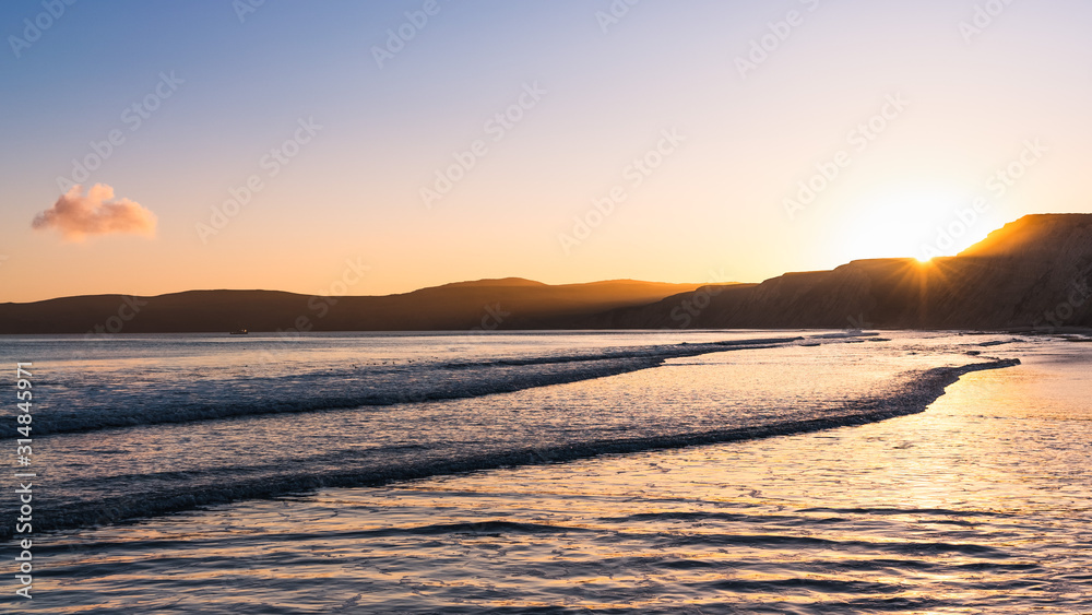 Sunset view of the Pacific Ocean shoreline, Drakes Beach, Point Reyes National Seashore, California