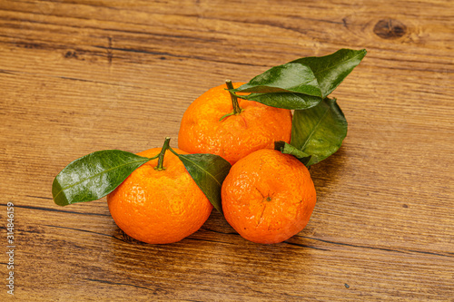 Ripe sweet tasty tangerine with leaves