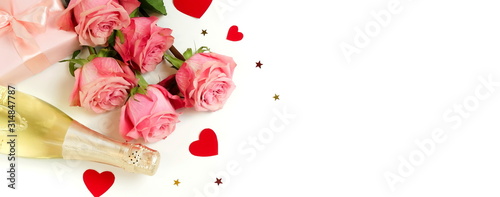 Valentine's day background banner. Bouquet of pink roses flowers, gift box an...