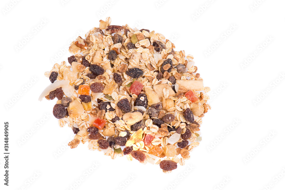 Muesli with nuts and dried fruits isolated on a white background, close up Muesli with nuts and dried fruits isolated on a white background, close up