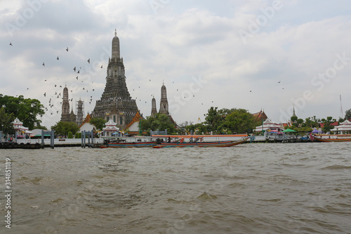 Wat arun ratchawararam ratchawaramahawihan or Wat arun or Arun temple at side of Chao phraya river photo