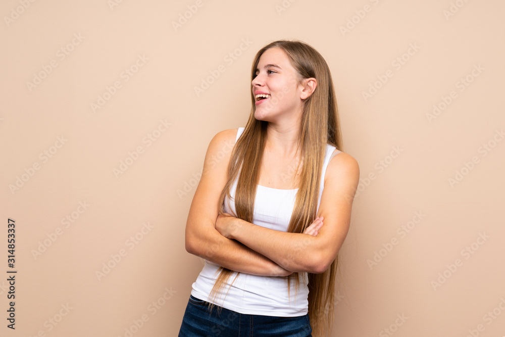 Teenager blonde girl over isolated background happy and smiling Teenager blonde girl over isolated background happy and smiling
