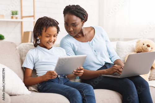 Caring mom providing children's online privacy protection photo