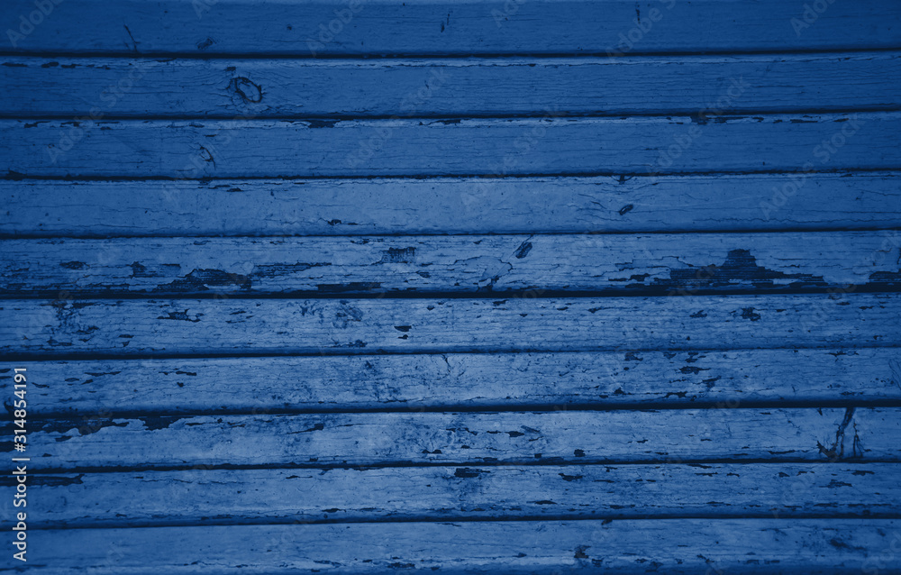 Obraz premium Texture of classic blue wooden boards. Grunge texture old wood. Classic blue color wood texture background surface with old natural pattern. Wood texture background, wood planks. Color trendy 2020.