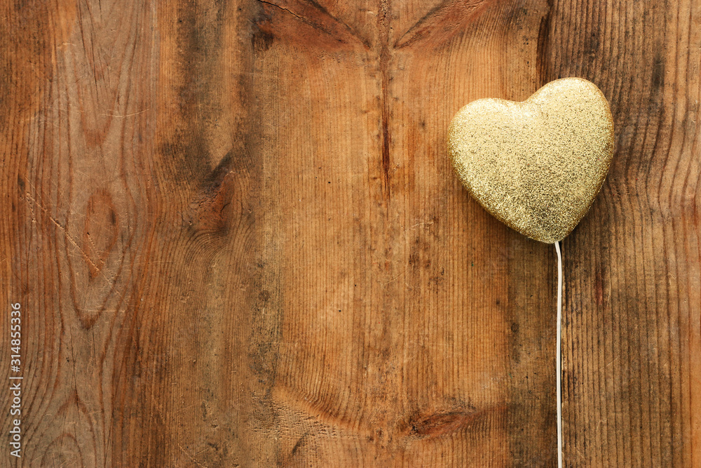 Fototapeta premium Valentines day concept. gold glitter hearts over wooden background. Flat lay composition