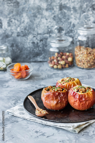 Baked apples with nut granola and pumpkin seeds.