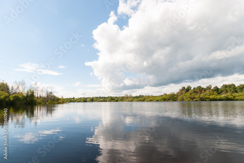 Fototapeta Naklejka Na Ścianę i Meble -  Beautiful landscape with a view of the lake and clouds in the sky