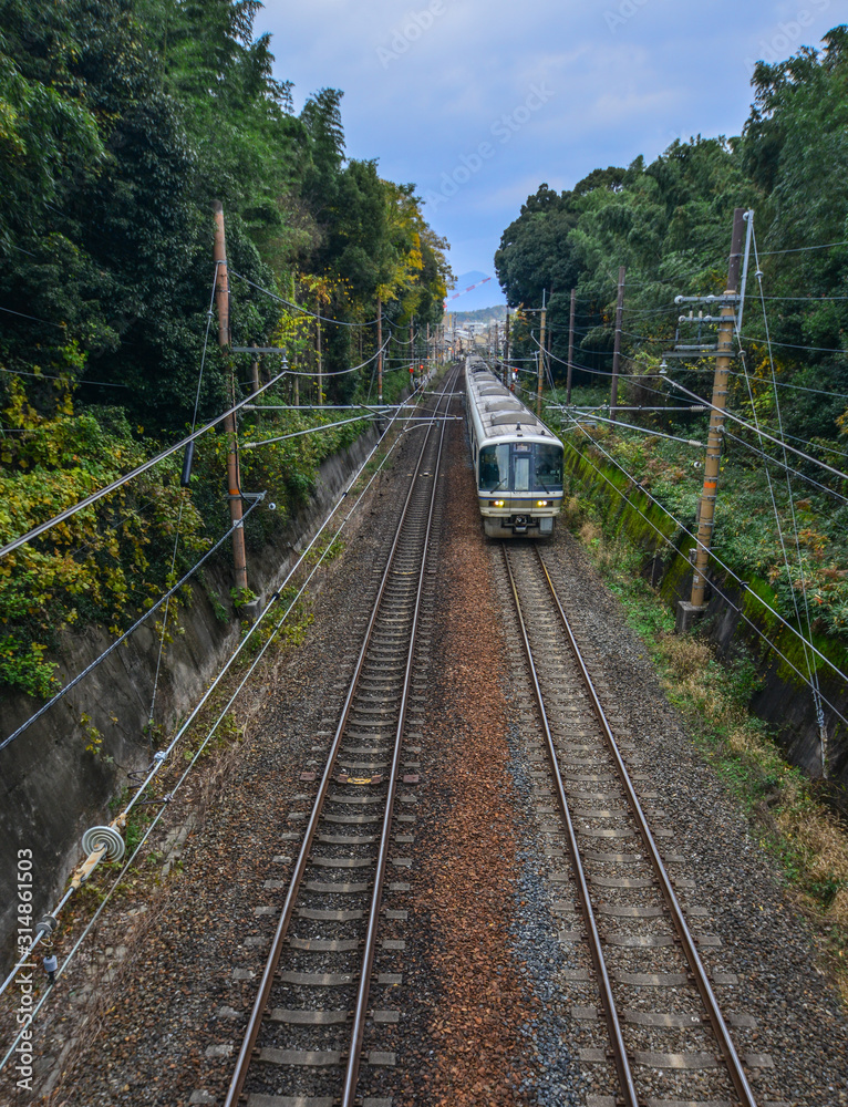 A train on rail track in Kyoto, Japan