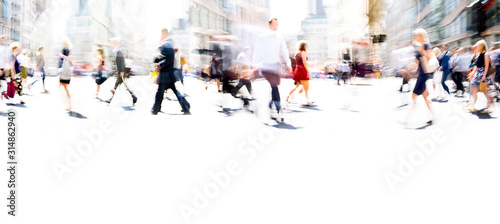 Lots of business people walking in the City of London. Blurred image, wide panoramic view of the crossroad with people at sunny day. London, UK