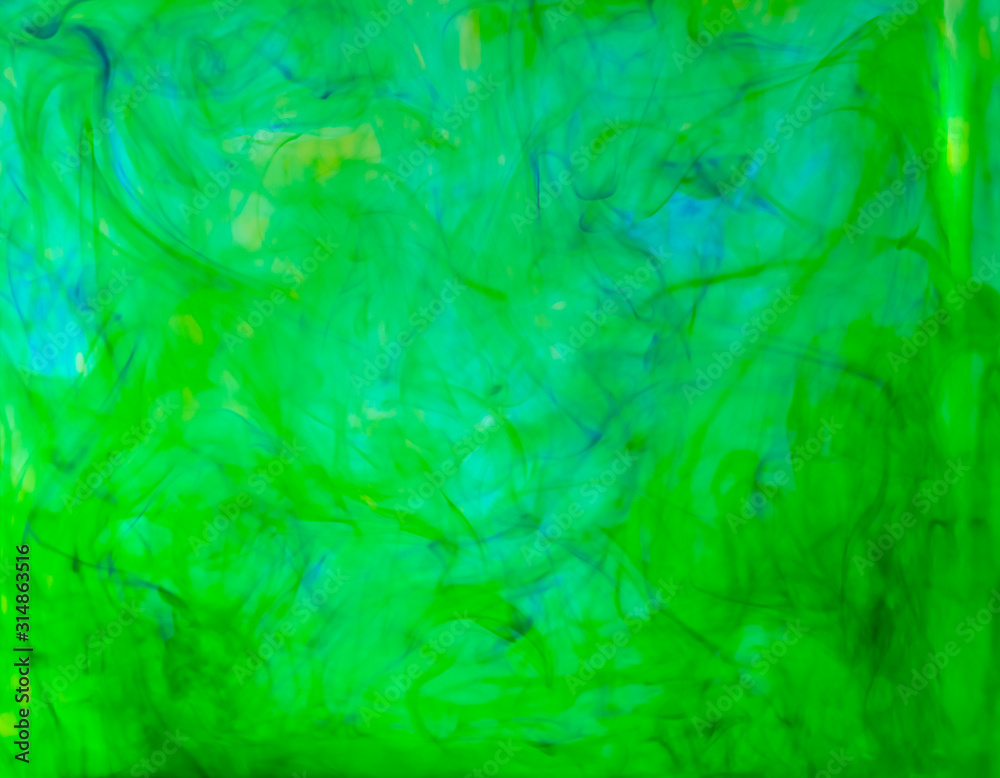 Blurred photo of food color drop and dissolve in water for background and texture concept. Blurred photo of food color drop and dissolve in water for background and texture concept.