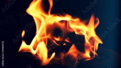 Fire  flames on a black background isolate. Concept fire grill heat weekend barbecue  Flame heat fire abstract background black background. Dangerous concept  