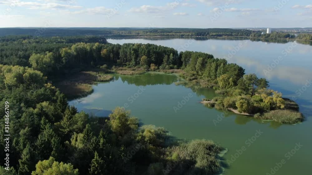 Beautiful forest. Aerial shot. Blue lake among the forest. Beautiful forest. Aerial shot. Blue lake among the forest.