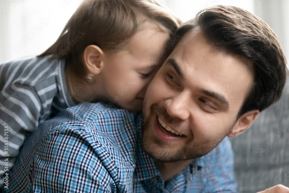 Happy young father and little son playing at home Happy young father and little son playing at home