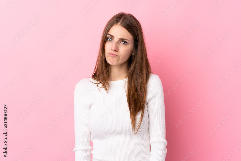 Young woman over isolated pink background with sad and depressed expression Young woman over isolated pink background with sad and depressed expression