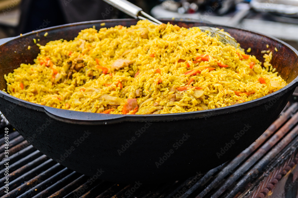 Big pan with pilaf on street festival