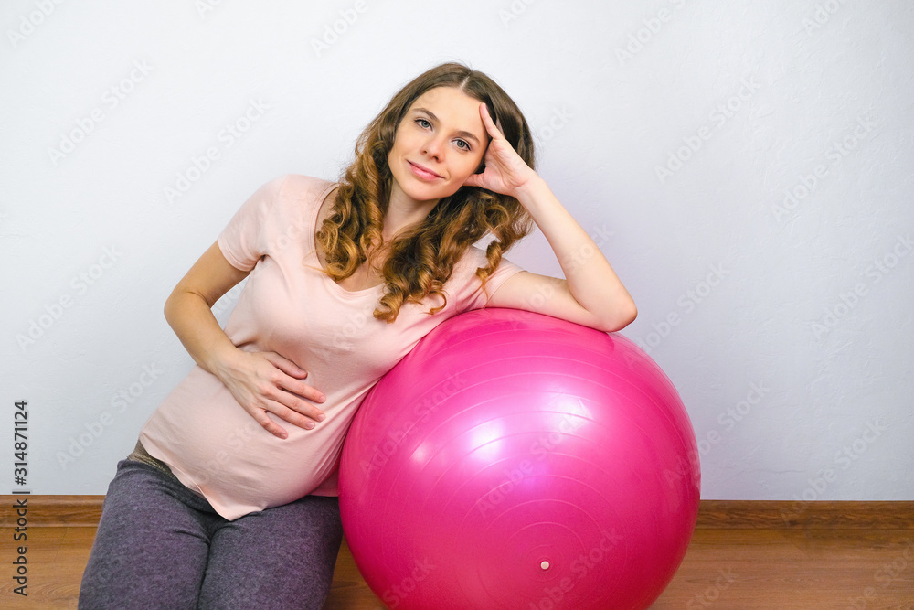 Beautiful pregnant mom with fit ball. Home fitness and active pregnancy concept. Beautiful pregnant mom with fit ball. Home fitness and active pregnancy concept.
