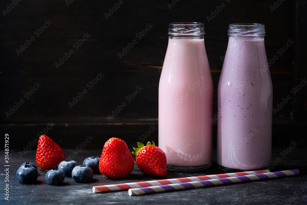 bottles of smoothies with fresh berries bottles of smoothies with fresh berries