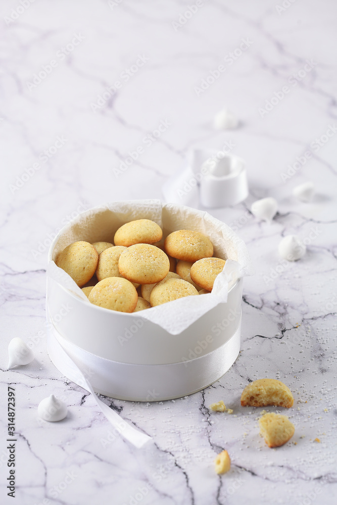 Little round Vanilla Butter Cookies, round box, plate, coffee, light marble background. Little round Vanilla Butter Cookies, round box, plate, coffee, light marble background.