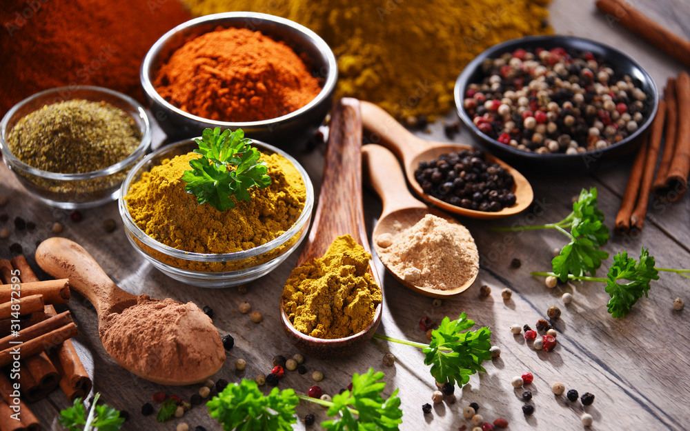 Variety of spices on kitchen table Variety of spices on kitchen table