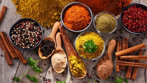 Fototapeta Naklejka Na Ścianę i Meble -  Variety of spices on kitchen table