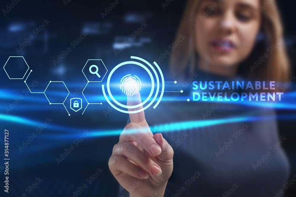 Business, Technology, Internet and network concept. Young businessman working on a virtual screen of the future and sees the inscription: Business, Technology, Internet and network concept. Young businessman working on a virtual screen of the future and sees the inscription: