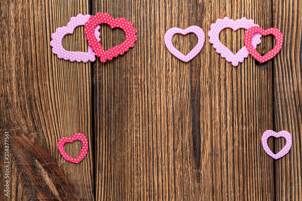 Present gift card with hearts and flowers for Valentine day on the wooden background Present gift card with hearts and flowers for Valentine day on the wooden background