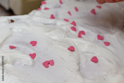 Heart shape cake decoration cooking process. Valentines day gift preparation dating.