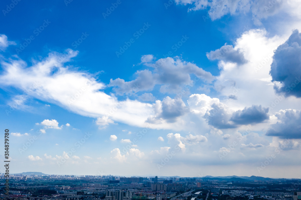 blue sky background with tiny clouds blue sky background with tiny clouds