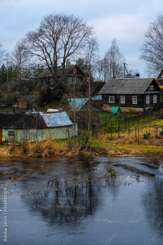 country houses on a bank of Volhov river in Volhov, Russia
