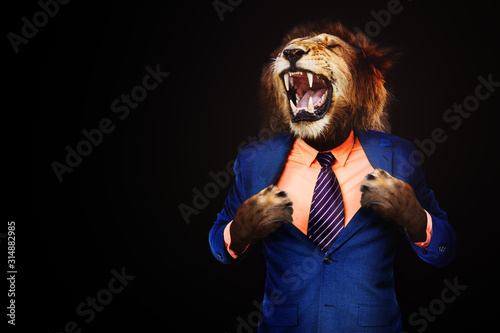 Furious angry businessman with face of lion roar