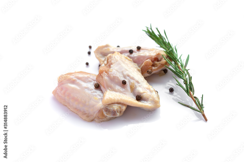 Raw chicken wings with garlic, pepperand rosemary isolated
