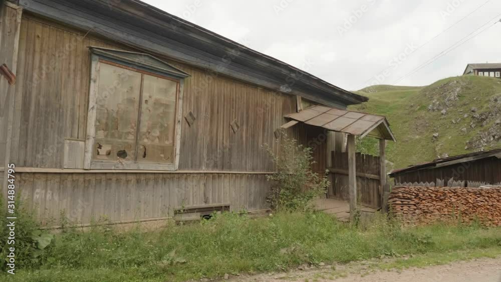 Panoramic view of old wooden abandoned house in russian Ural village. Panoramic view of old wooden abandoned house in russian Ural village.