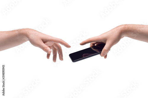 Two male hands passing one another a smartphone on white background