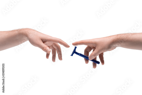 Two male hands passing one another a disposable razor on white background