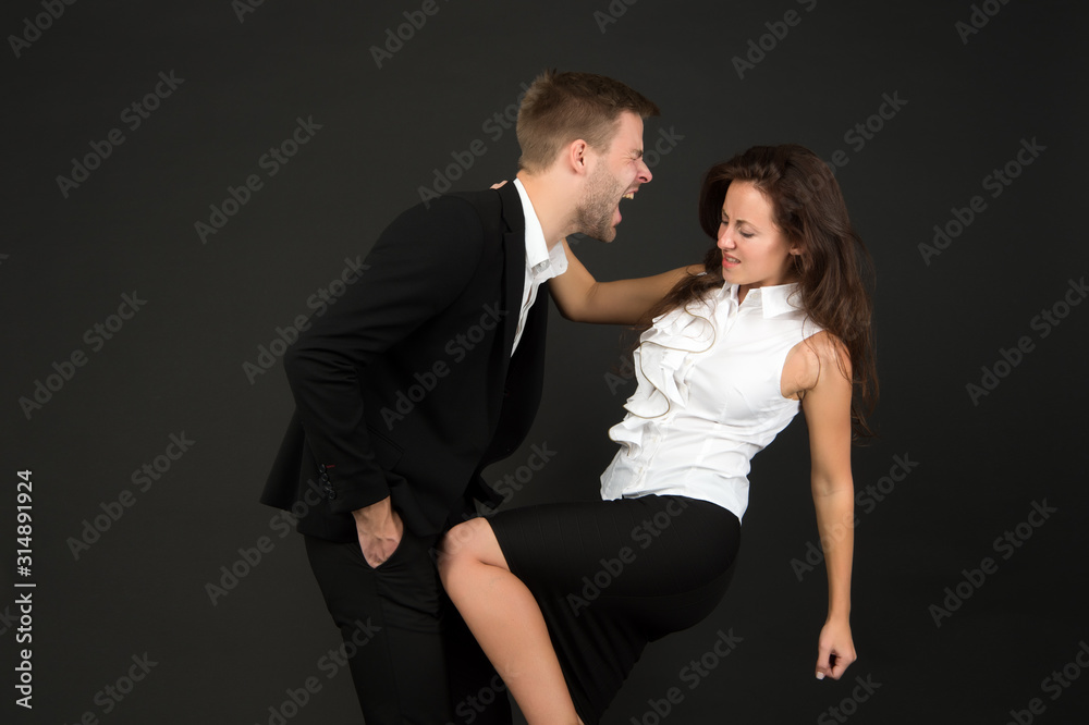 kicked him in balls. couple fight. disagreements between business partners. man and woman quarrel. problems in relationship. Defend your opinion in confrontation. Struggle for gender equality kicked him in balls. couple fight. disagreements between business partners. man and woman quarrel. problems in relationship. Defend your opinion in confrontation. Struggle for gender equality