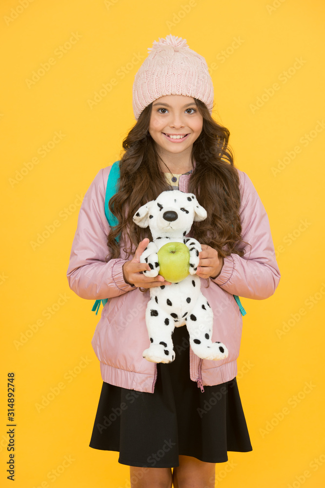 Afterschool special. Happy girl go to afterschool with toy dog. Little schoolchild yellow background. Afterschool time. School and education. Afterschool activities. Learn and play. Autumn season Afterschool special. Happy girl go to afterschool with toy dog. Little schoolchild yellow background. Afterschool time. School and education. Afterschool activities. Learn and play. Autumn season