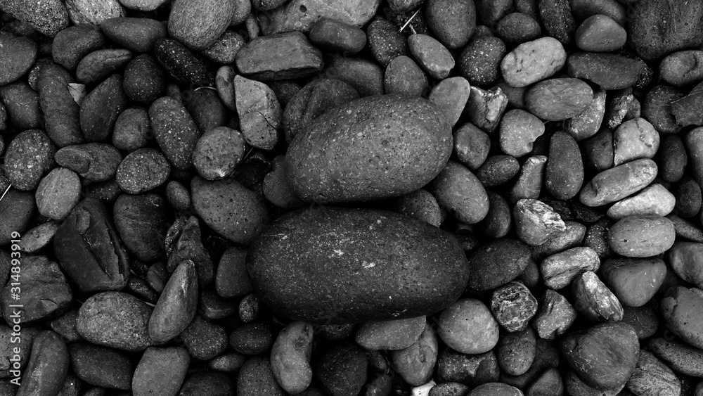 black pebbles on the beach background black pebbles on the beach background